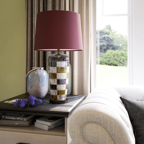 Torino Table Lamp With Ceramic Multicolor Squares Finish, Brown Tapered Drum Shade, in modern living room setting.