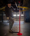 Mechanic using Three Quarter Ton Underhoist Support Stand With Foot Pedal, Large Base, Heavy Duty in garage