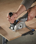 User operating Super Duper Versatile 20Volt Max Cordless Compact Multi Saw Tool Kit on plywood for precise cutting.