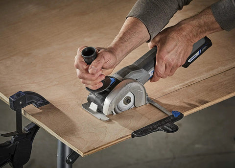 User operating Super Duper Versatile 20Volt Max Cordless Compact Multi Saw Tool Kit on plywood for precise cutting.