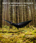 All In One Camping Hammock Kit With Bug Net And Rain Fly for Easy Setup in mossy forest, featuring ripstop nylon hammocked person.