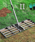Lawn Leveling Rake With Stainless Steel Long Handle Pro Grade on grass, includes gardening gloves and soil pile.