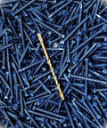 A close-up of a Bulk Pack Of 3000 Hex Washer Head Concrete Screws Three Sixteenth By One And Three Quarter Inch Tapcons With Three Bonus Bits