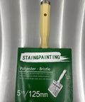 Pro Grade Deck Fence And Siding Staining Brush With Load Handler, 5-inch, polyester bristle, on metallic surface.