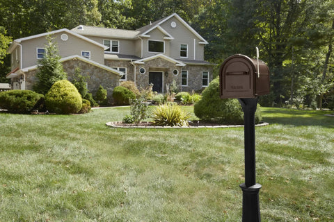 Hillsborough Heavy Duty Copper Post Mounted Mailbox For Outdoor Use With Rust Resistant Steel Construction in front of house