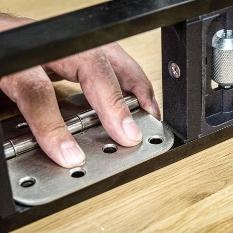 All-In-One Adjustable Door Hinge Jig Installation Kit For 2 Ft 6 In To 9 Ft Doors close-up of hinge fitting in jig