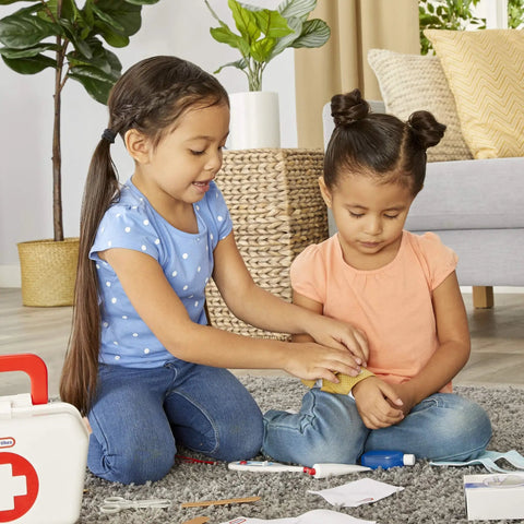 Two children playing with Realistic Kids First Aid Kit For Pretend Doctor Play With 25 Accessories Including Gauze Pads And Bandages