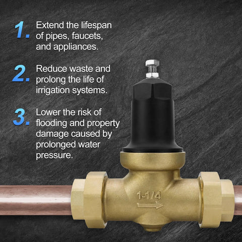Front view of 1-1/4 inch brass pressure reducing valve with black cap and NPT threaded ends on copper pipe.