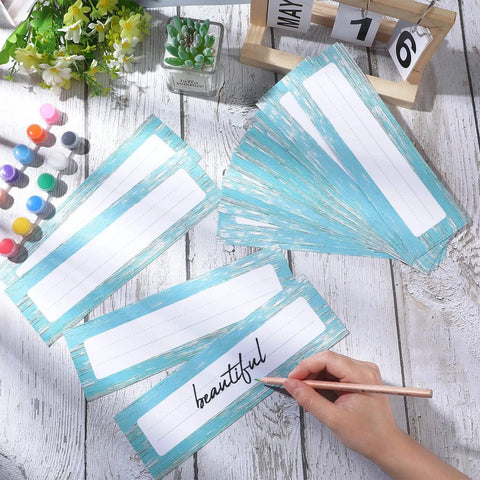 Bulk 60 Sheets Rustic Classroom Name Plates For Desks And Tags Die Cut Flat Nameplates arranged on a white table.