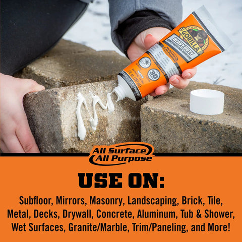 Hand using Heavy Duty Construction Adhesive White Glue 7 Ounce Squeeze Tube Tough As Nails for indoor and outdoor projects on stone