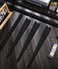 Black Twin Rail Wall Shelving System With Adjustable Twenty Five Inch Shelves And Eleven Point Five Inch Brackets Heavy Duty No Fuss DIY Ready Storage Rack components including brackets and screws on display.
