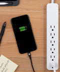 6-Outlet Surge Protector Power Strip Set With 2 Ft Extension Cords, 620 Joules, Flat Plug charging phone on desk setup