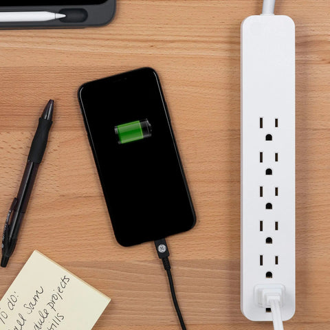 6-Outlet Surge Protector Power Strip Set With 2 Ft Extension Cords, 620 Joules, Flat Plug charging phone on desk setup