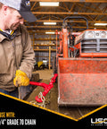 Man using Heavy Duty Load Binders for 1/4 Inch Grade 70 Chain, 3150 Lbs Working Load Limit, securing equipment on trailer