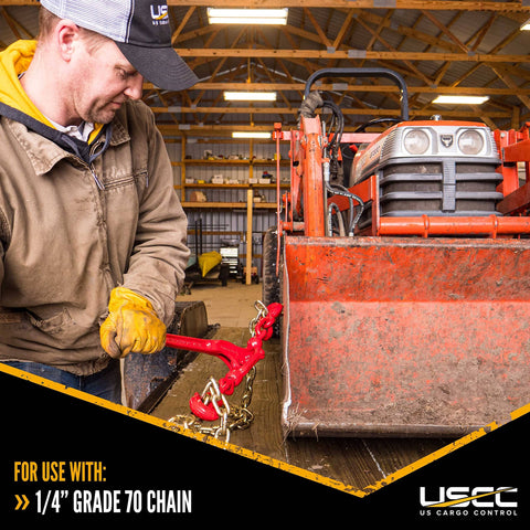 Man using Heavy Duty Load Binders for 1/4 Inch Grade 70 Chain, 3150 Lbs Working Load Limit, securing equipment on trailer
