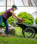 Person using Beefy Heavy Duty Utility Cart With 10 Cubic Feet Tub And 400 Pound Load Capacity With Flat Free Wheels in yard