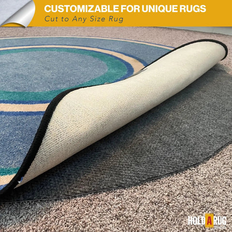 Nonskid Rug Pad 3' x 5' Plush Reversible Gripper One Quarter Inch Thick shown under a blue area rug, highlighting its thickness and grip.