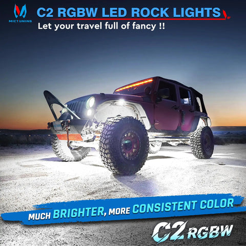 Curved RGBW LED Rock Lights Kit With 12 Pods Underglow Multicolor Neon Lighting on off-road Jeep at sunset