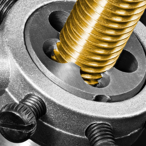 Close-up of M14 X 1.0 Left Hand Thread Die Pro Grade Heavy Duty Alloy Tool Steel in metal threading process