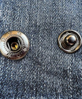 Close-up of 15Mm Metal Snap Fastener Kit With Pliers And Adapter 40Set Dope Black Button Snaps Press Studs on denim