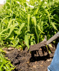 Compact Perennial Garden Shovel With Serrated Blade For Precise Digging And Root Cutting in garden soil with plants
