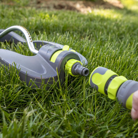 Garden Hose Nozzle Kit, 3-Piece With Quick Connect Sprayer And Flow Stop Adapter shown on grass lawn