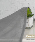 Close-up of Gray Faux Linen Sheer Curtains Set 2 Panels Each 40x96 Inches with textured material for farmhouse living room or bedroom