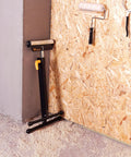 Roller Support Stand Twin Pack With 132 Lb Capacity Each, Heavy Duty Steel Roll Stand leaning against a workshop wall