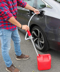 Person using Battery Powered Fuel Transfer Pump With Auto Stop for gas transfer with extra long hose and suction tube, portable at 2.4 GPM