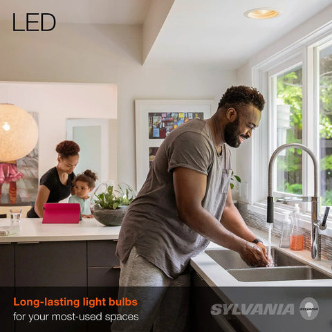 Man washing hands in kitchen with LED BR30 Flood Light Bulb 65W Equivalent Energy Saving 9W Dimmable illuminating the room