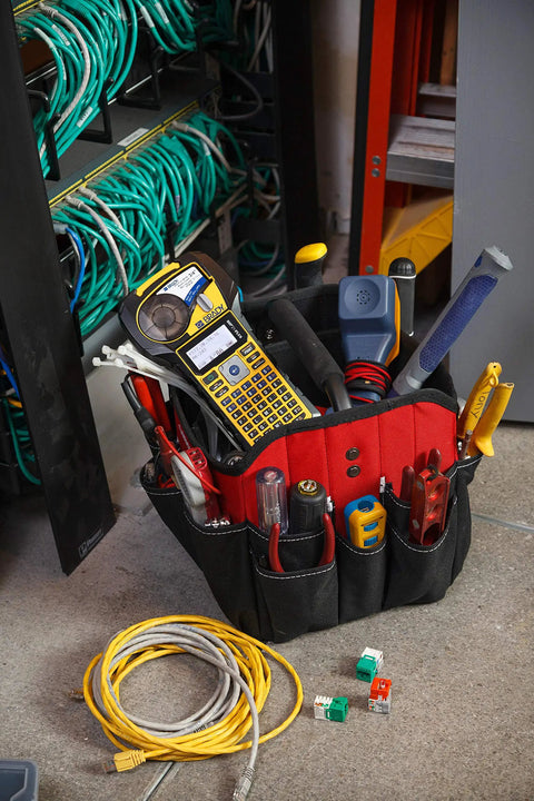 Top Shelf Portable Color Label Maker Kit With Rugged Carrying Case And Fast Swap Battery for use in a tool bag filled with equipment.