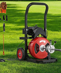 Heavy Duty Electric Drain Snake With 75 Foot Solid Steel Cable And 450 Watt Motor in grassy outdoor setting with tools.