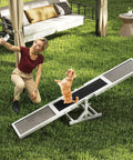 Wooden Dog Agility Seesaw For Backyard Play And Training with woman and dog interacting, weatherproof, stable base in garden