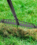 Extra Wide 17 Inch Double Sided Garden Rake in use on grass, showing heavy duty lightweight stainless steel construction