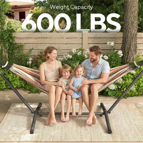 Family sitting on 600 Lb Hammock With Stand For Outdoor Or Indoor Use 2 To 3 Person Portable Hammock, brown and black.