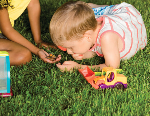 Children playing with Bug Bungalow Insect Catching Kit For Kids With Mesh Case Magnifying Container Tweezers And Magnifier
