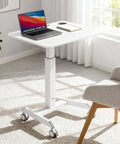 Portable Laptop Cart On Wheels With Adjustable Height Sit Stand Desk And A 28.5 By 22 Inch Tabletop In White in an office scene
