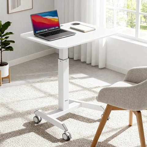 Portable Laptop Cart On Wheels With Adjustable Height Sit Stand Desk And A 28.5 By 22 Inch Tabletop In White in an office scene