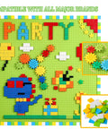 Game Changing 812 Piece Building Blocks Kit Featuring Self Adhesive Wall Baseplates And Interconnected Marble Run Tracks For Kid Approved STEM Projects And No Fuss Setup displayed on a green wall base with colorful designs and accessories.
