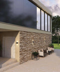 Modern facade with Dope 4 Inch Square LED Wall Sconce for indoor and outdoor use; die cast aluminum housing, evening view.
