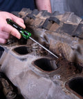 Mechanic using the Six Piece Hook And Pick Set With Acetate Handle For Mechanics Car Repair Gasket And Hose Removal on engine gasket.