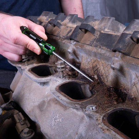 Mechanic using the Six Piece Hook And Pick Set With Acetate Handle For Mechanics Car Repair Gasket And Hose Removal on engine gasket.