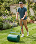 Man using Tough-As-Nails Rust-Resistant Steel Lawn Roller For Yards And Gardens, 46L (13 Gal) Capacity, 23 Inch Push Or Tow Behind.