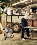 20-Inch High Velocity Floor Fan For Garage And Workshop in use, cooling a workshop with heavy-duty metal shop fan, 3 speed settings visible.