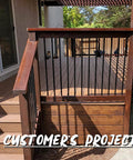 Wooden deck with 26 Inch Grooved Aluminum Deck Balusters Hollow Round Rail Spindles Matte Black 50 Pack railing upgrade.