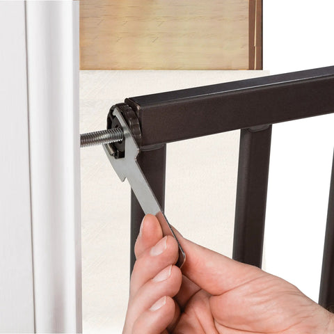 Hand tightening pressure mount bolt on Decorative Walk-Thru Baby And Pet Gate For Openings Up To 60 Inches, walnut wood and charcoal metal accents.