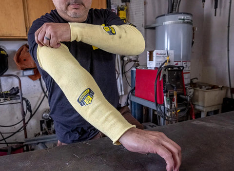 Man wearing Heavy Duty Eighteen Inch Kevlar Arm Sleeves Featuring Legit A3 Cut Resistant Armor and Heat Proof double layer weave.