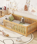 Twin Montessori Floor Bed Frame In Natural Pine With Attached Safety Fence Gate low profile design in nursery room with bedding.