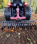 Tow Behind Landscape Rake with 48 Inch Working Width, 17 Steel Tines, 2 Inch Receiver attached to tractor removing leaves
