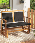 Two Person Wooden Outdoor Glider Bench With Acacia Wood Armrests And Wicker Back And Seat Rocking Patio Loveseat on porch